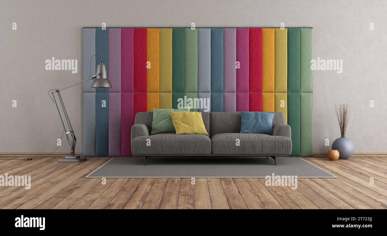 Paneles de tela colorida en una habitación moderna con sofá gris en el piso de madera - representación 3D. Foto de stock