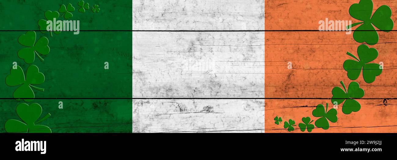St. Fondo del día de Patrick. Shamrocks contra el fondo de la bandera irlandesa. Decoración para St. Día de Patrick. Diseño de banner Foto de stock