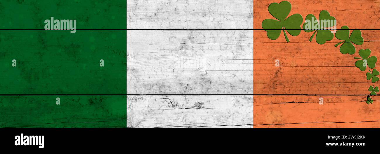 St. Fondo del día de Patrick. Shamrocks contra el fondo de la bandera irlandesa. Decoración para St. Día de Patrick. Diseño de banner Foto de stock