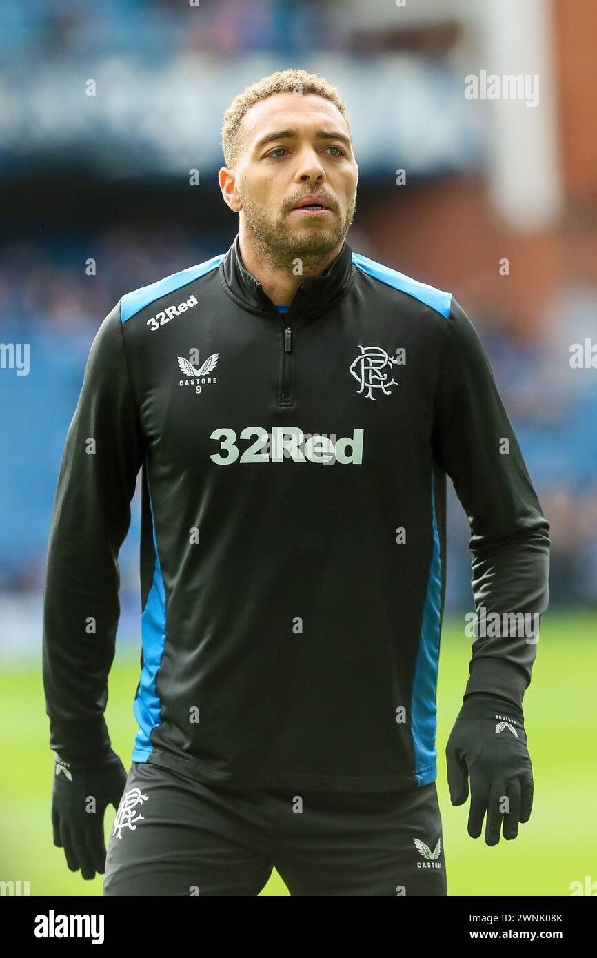 CYRIEL DESSERS, futbolista profesional, jugando para Rangers FC. Imagen tomada durante una sesión de entrenamiento y calentamiento en el estadio Ibrox, Glasgow, Foto de stock