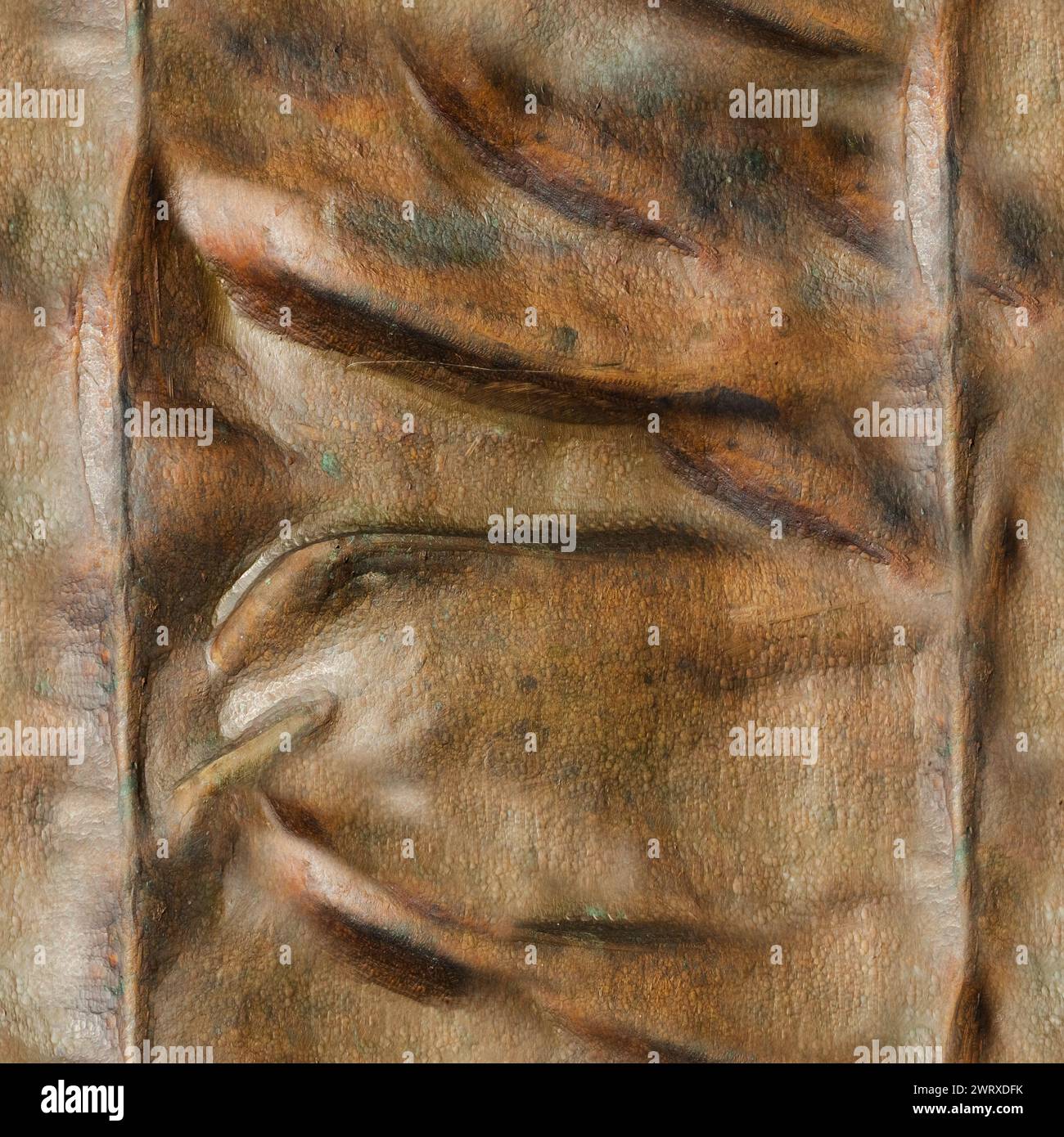 Foto de textura inconsútil de bronce o estatua de cobre superficie de pliegues de tela arrugada. Foto de stock