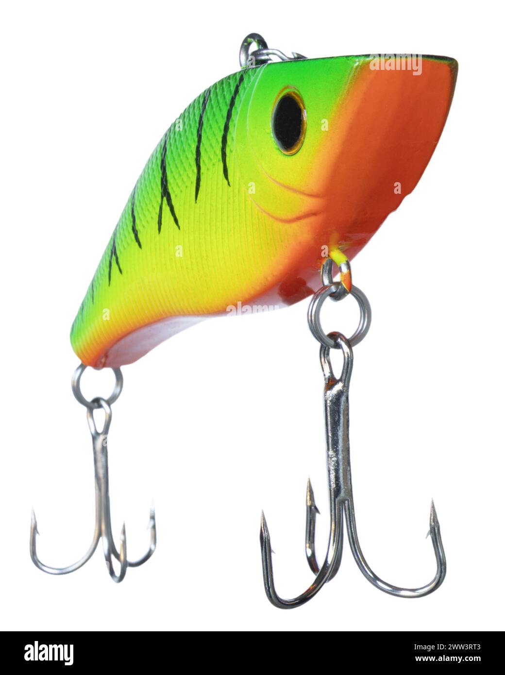 Crankbait verde, amarillo y naranja diseñado para la pesca de graves de gran tamaño con dos ganchos agudos que vienen a la cámara desde un ángulo. Foto de stock