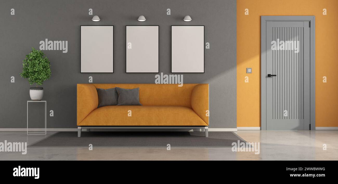 Elegante espacio de vida con un sofá naranja, marcos en blanco para obras de arte, decoración minimalista y puerta cerrada - representación 3D. Foto de stock