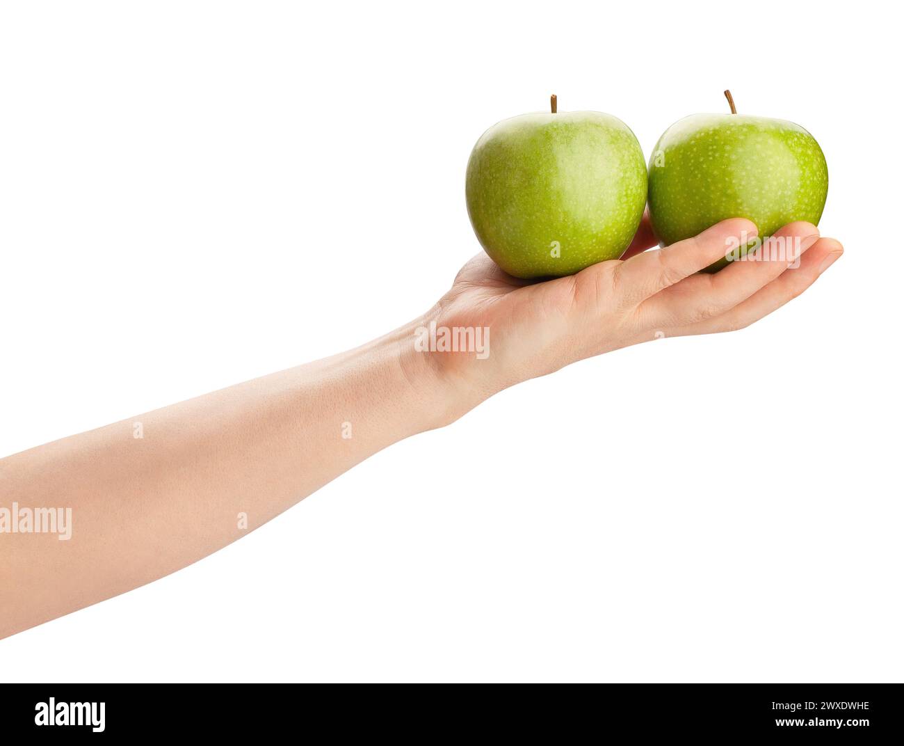 granny smith manzana en el camino de la mano aislado en blanco Foto de stock