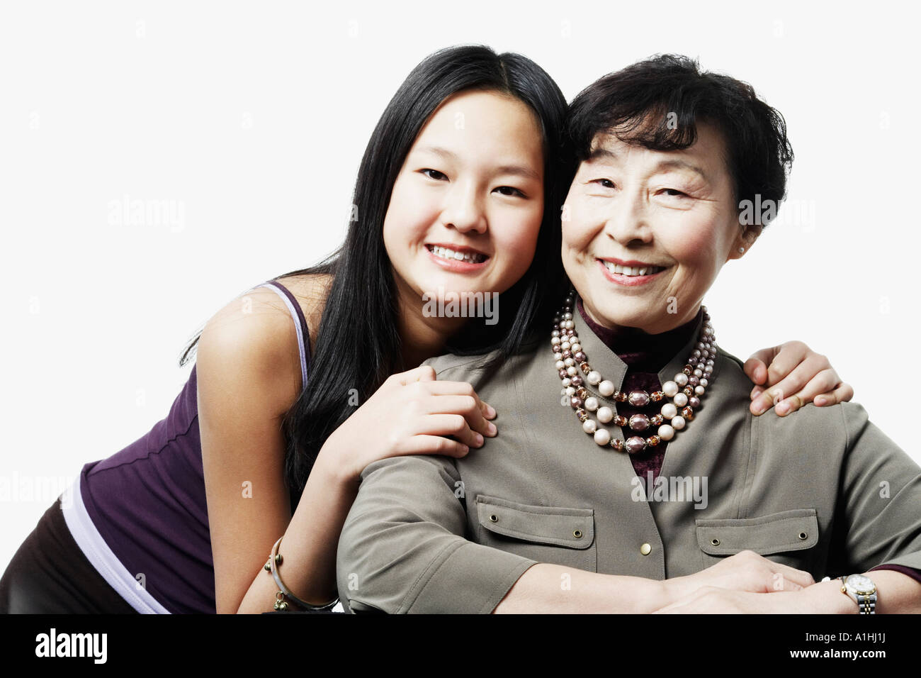 Retrato de una abuela y su nieta sonriendo Foto de stock