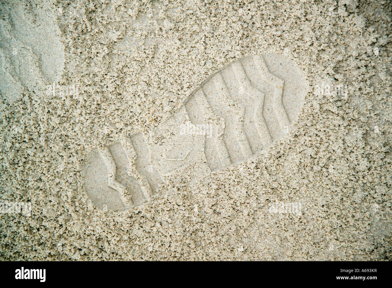 Impresión de zapata en arena blanda Foto de stock
