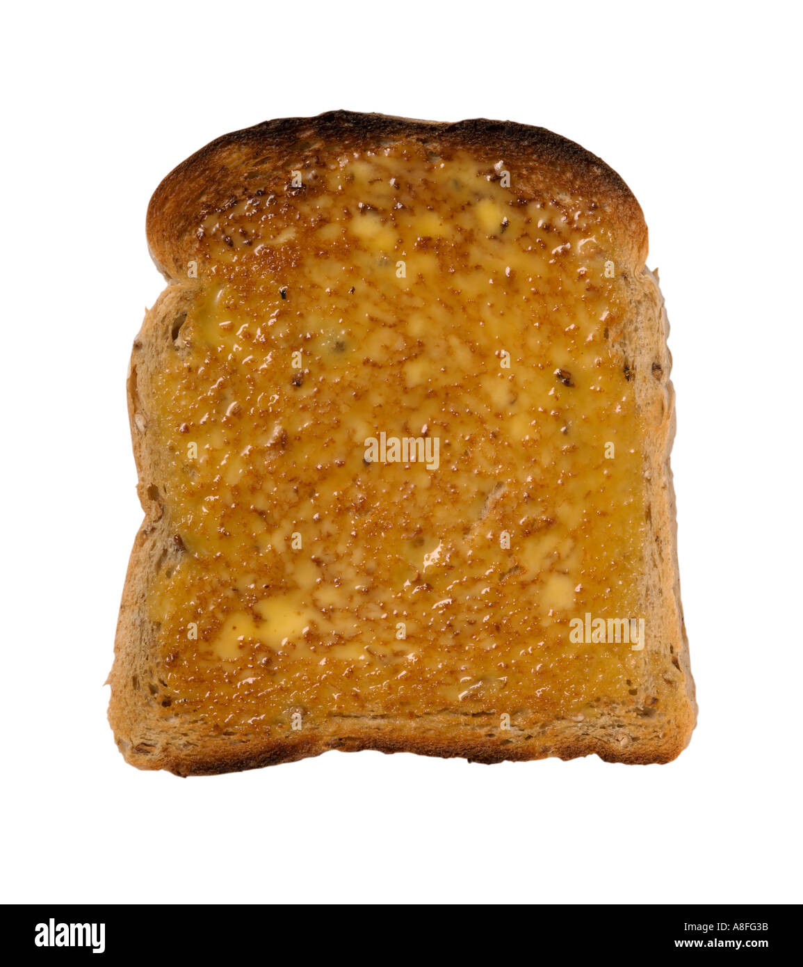 La rebanada de pan tostado untado con mantequilla Foto de stock