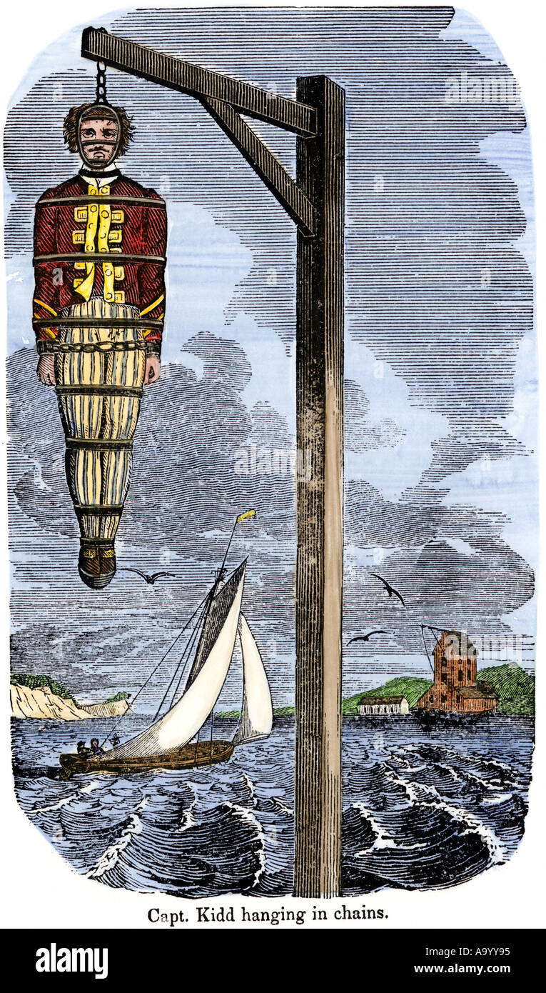Capitán pirata William Kidd en cadenas colgadas a muerte en Inglaterra 1701. Xilografía coloreada a mano Foto de stock