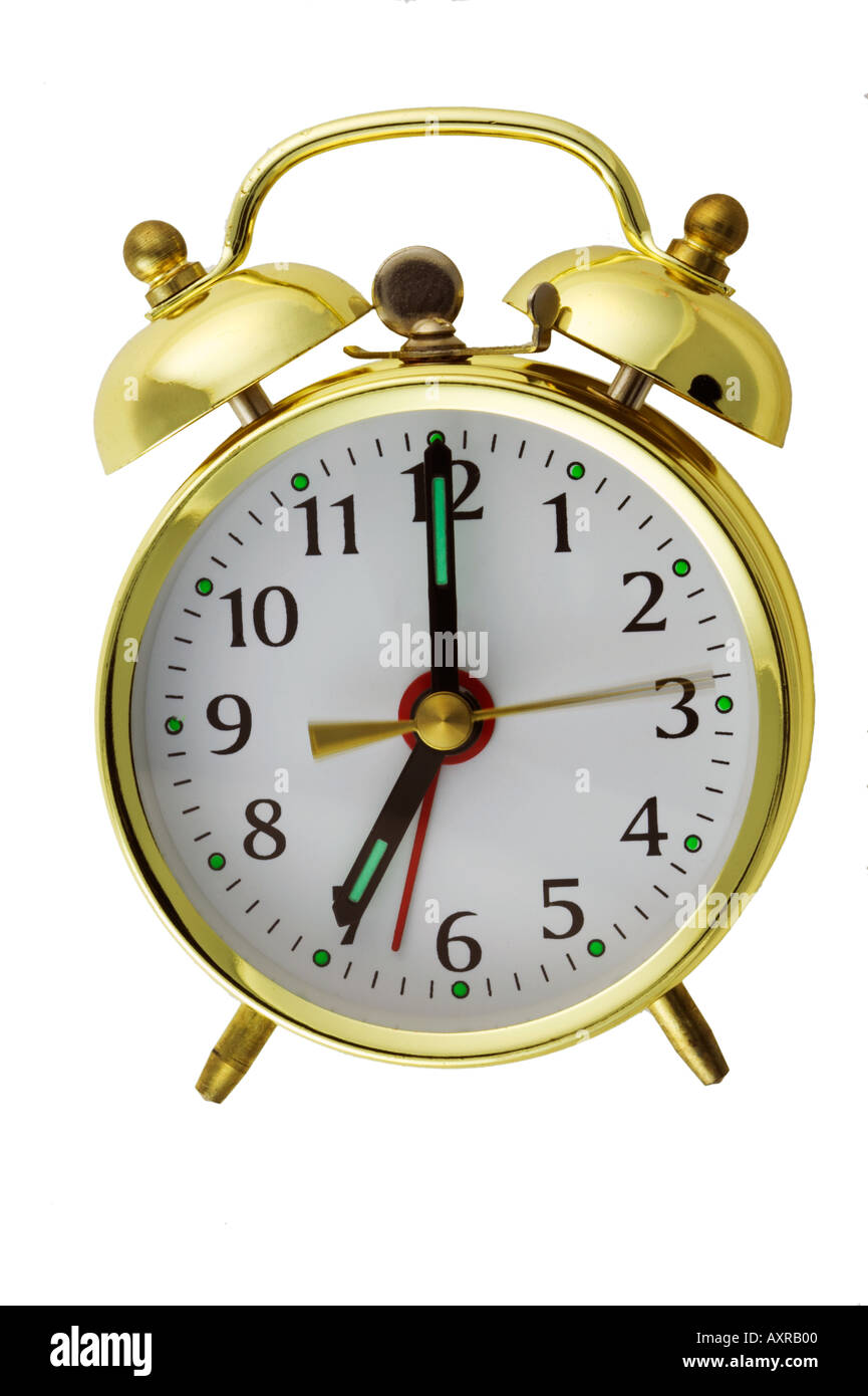 Reloj Despertador mecánico tradicional corte de segunda mano borrosa Foto de stock