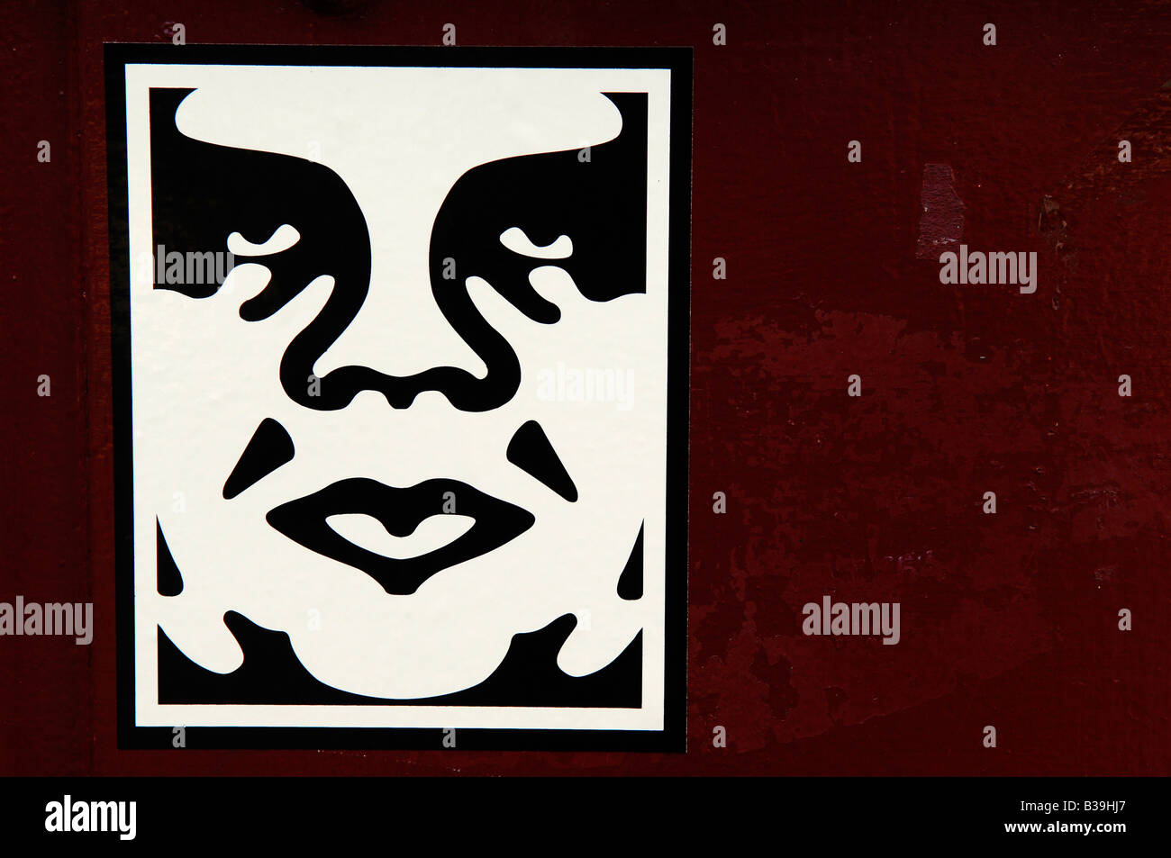 Obedecer diseño gigante americano Shepard Fairey usa sticker art cara roja ilustración gráfica Foto de stock