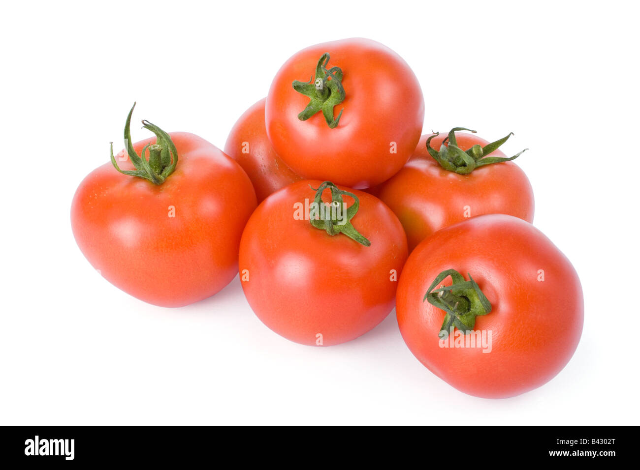 Tomates maduros aislado sobre un fondo blanco. Foto de stock