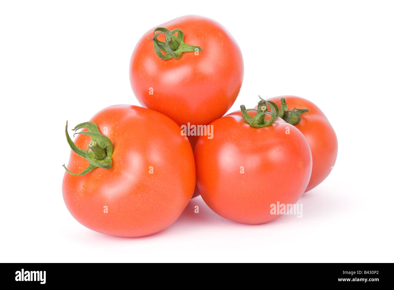 Tomates maduros aislado sobre un fondo blanco. Foto de stock