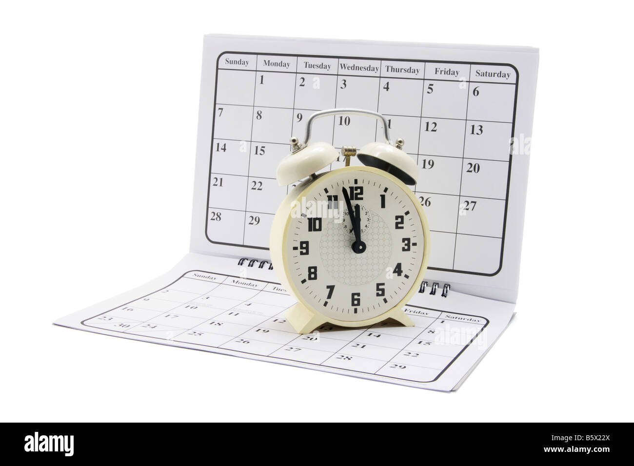 Reloj de alarma en el calendario Foto de stock