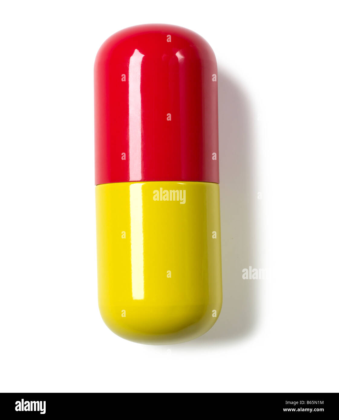 Píldora amarilla roja Foto de stock