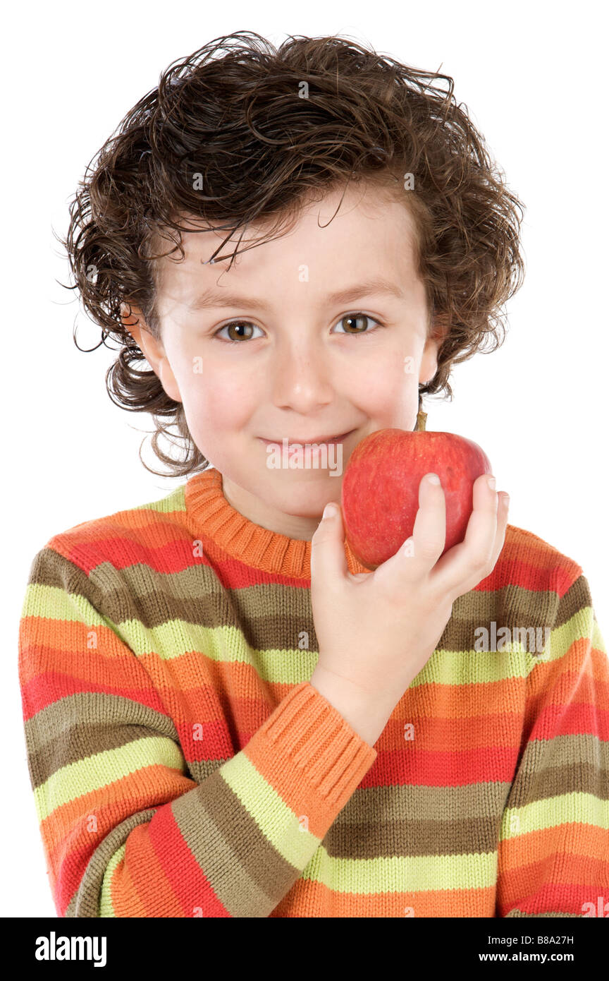 Niño con Apple sobre un fondo blanco. Foto de stock