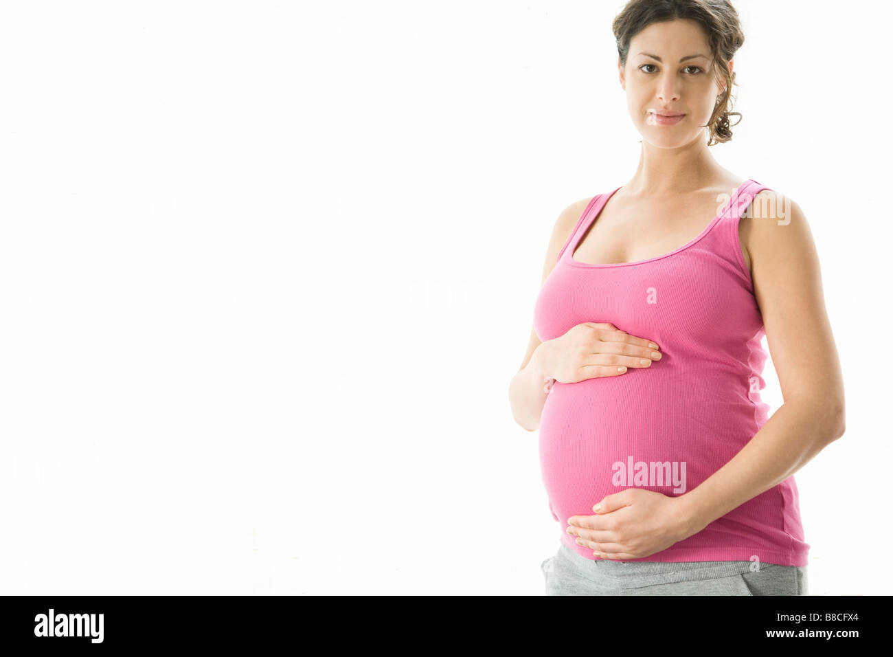 Retrato de estudio de la mujer embarazada Foto de stock