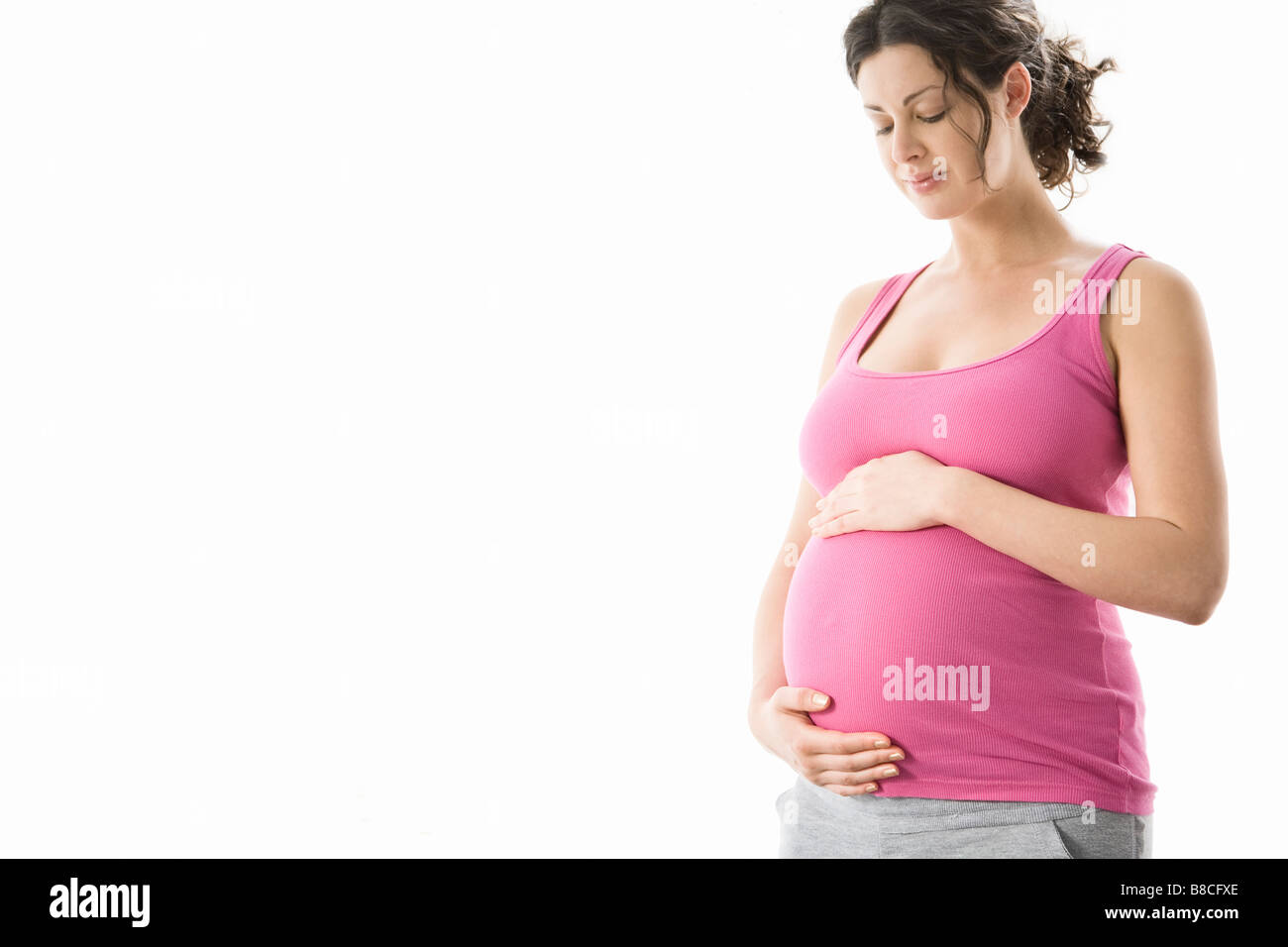 Retrato de estudio de la mujer embarazada Foto de stock