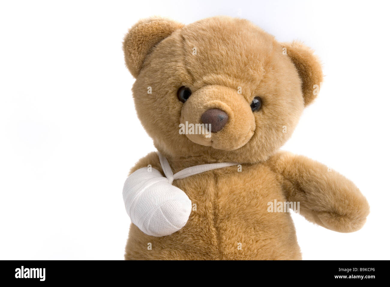 Oso de juguete con una pierna rota Foto de stock