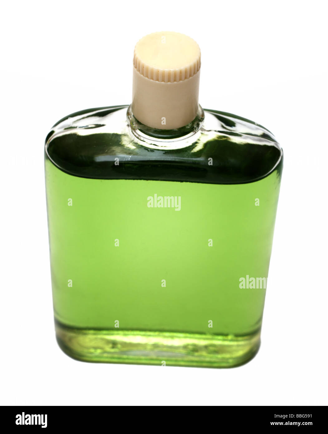 Antigua botella con colonia verde aislado en blanco Foto de stock