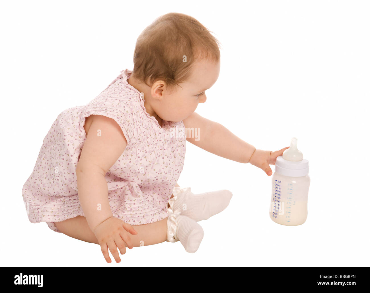 Bebé con biberón de leche Foto de stock