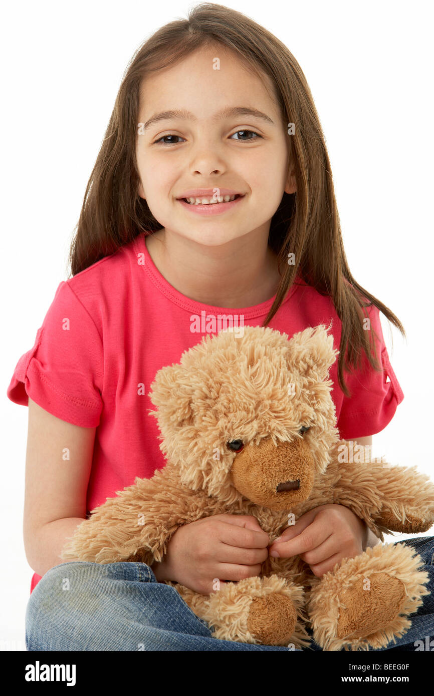 Retrato de estudio de chica sonriente con osito de peluche Foto de stock