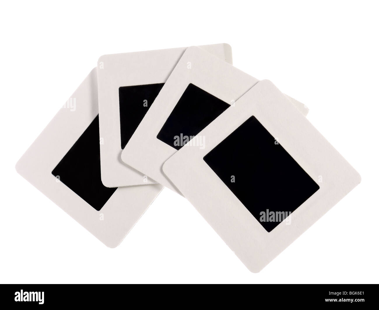 Cuatro diapositivas de 35 mm en blanco con bordes blancos rodada en blanco Foto de stock