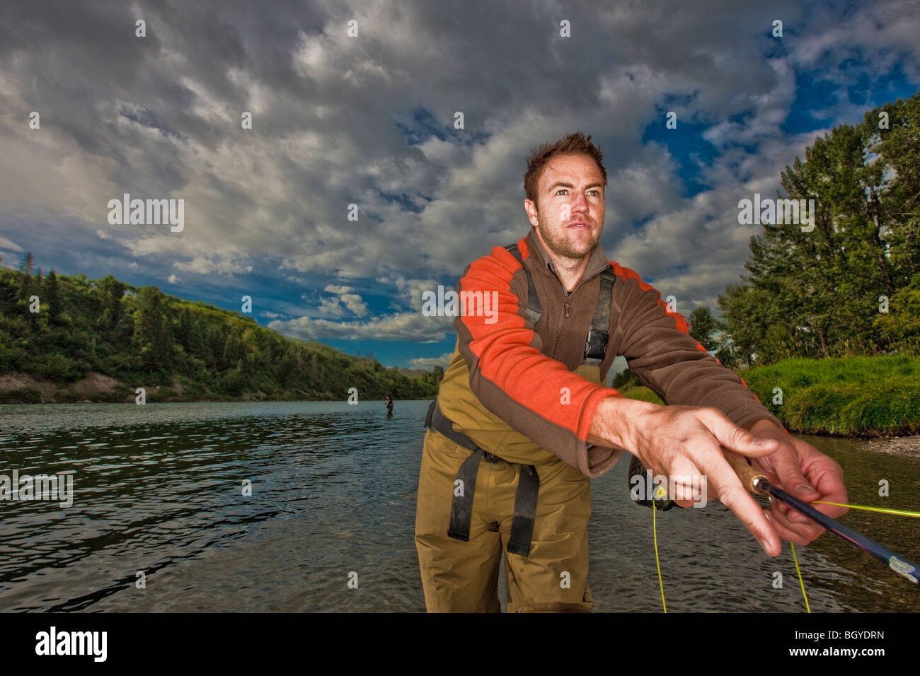 Pescador con mosca Foto de stock