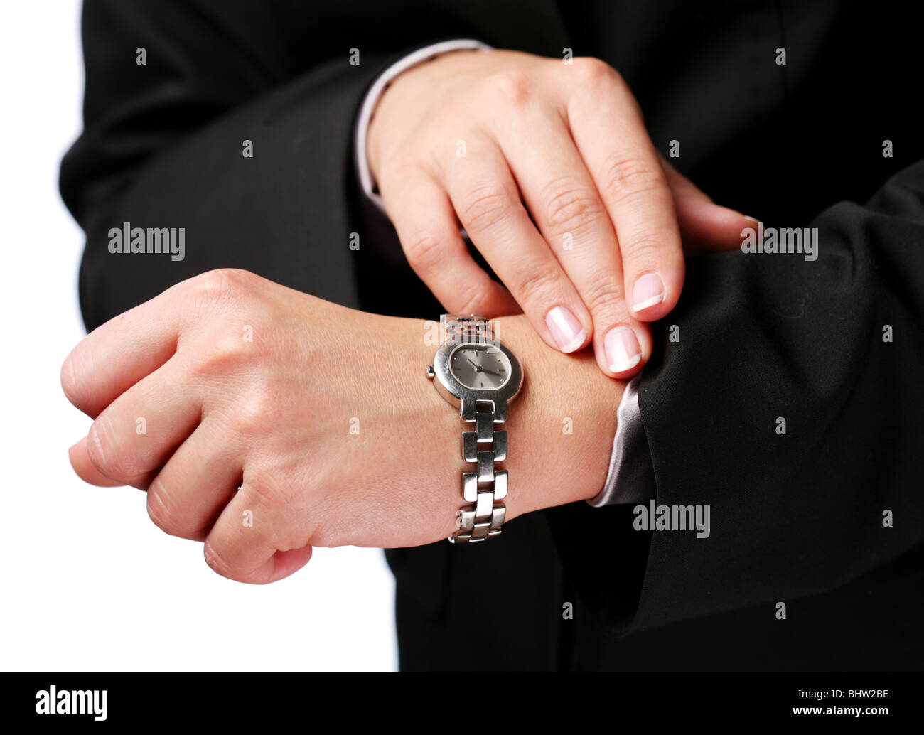 La empresaria mira su reloj Foto de stock
