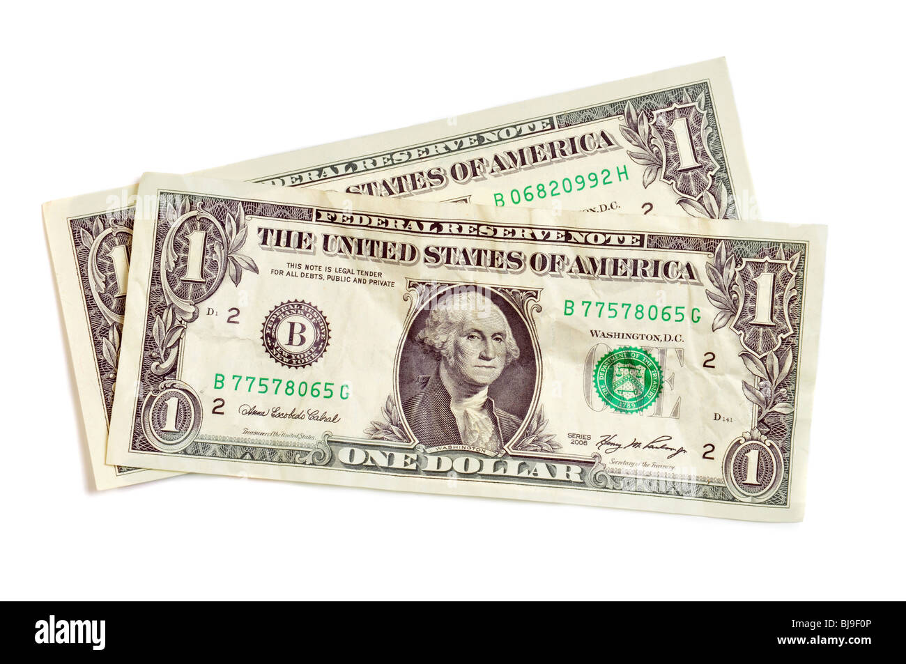 Dos billetes de un dólar aislado en blanco Foto de stock