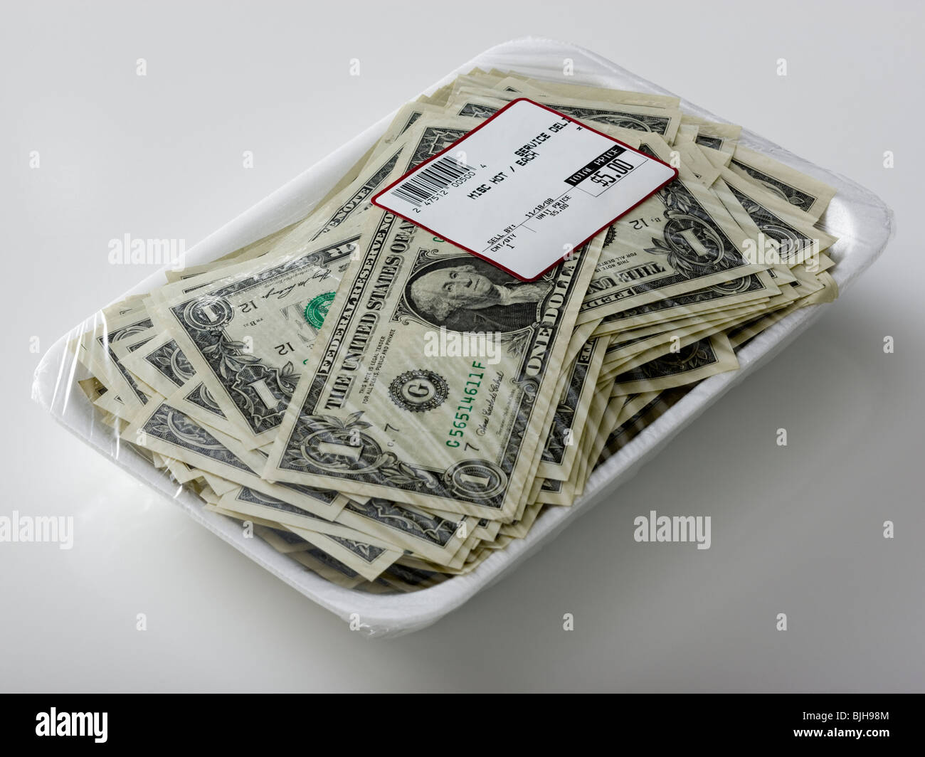 Dólares en un supermercado paquete shrinkwrap Foto de stock