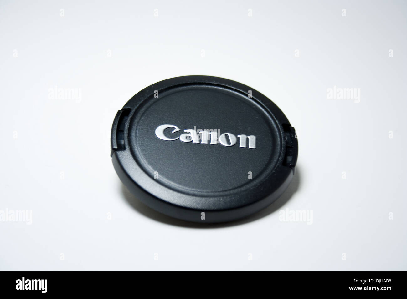 Tapa de lente lente canon negro logotipo de marca closeup macro producto Foto de stock