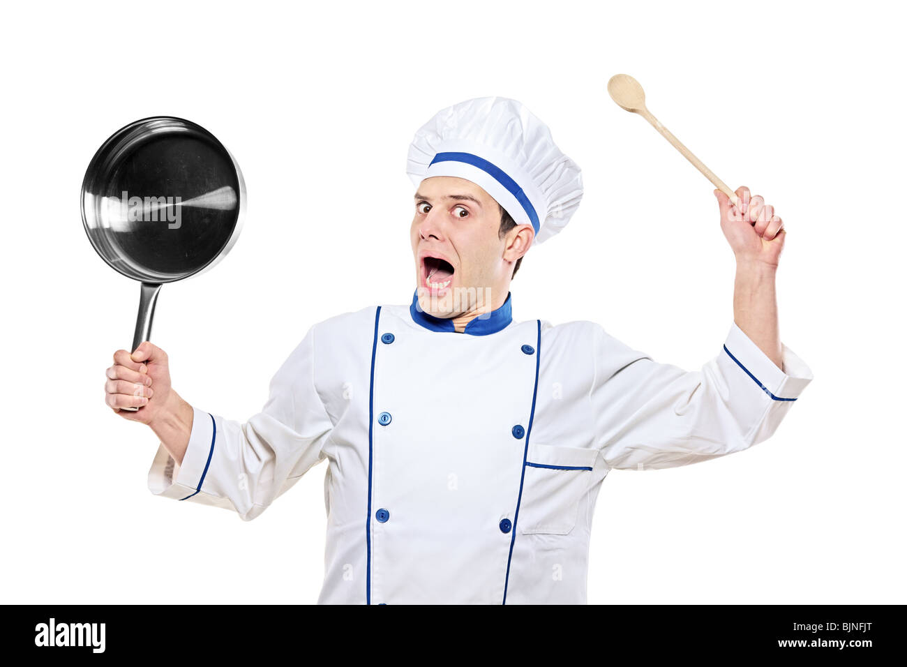 Aturdido chef celebración utensilio de cocina Foto de stock