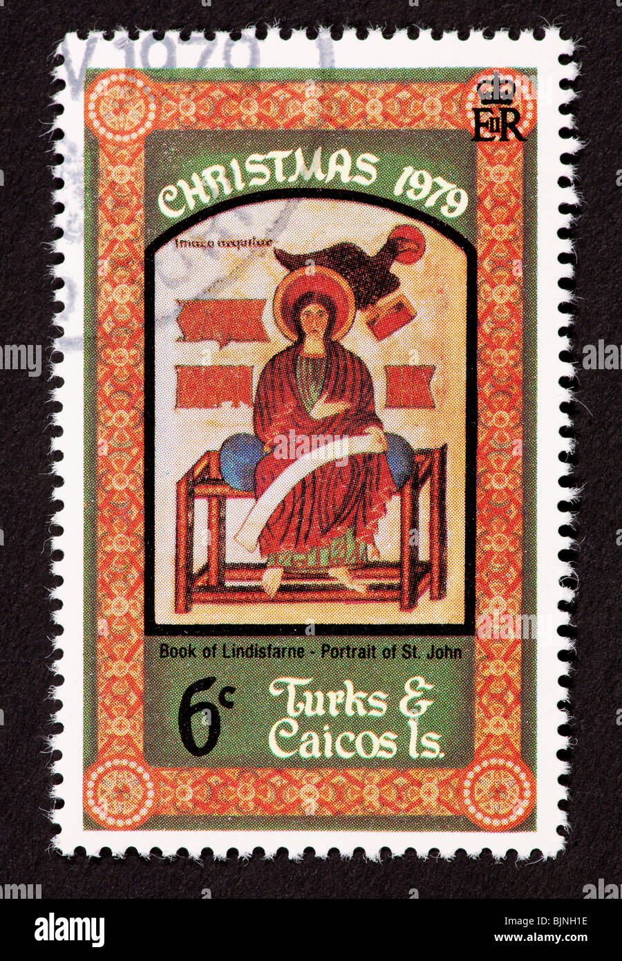 Sello de Islas Turcas y Caicos representando a San Juan (desde el libro de Lindisfarne). Foto de stock