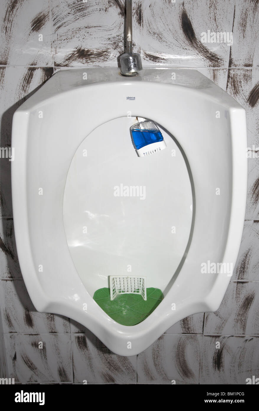 Urinal with soccer goal and football fotografías e imágenes de alta