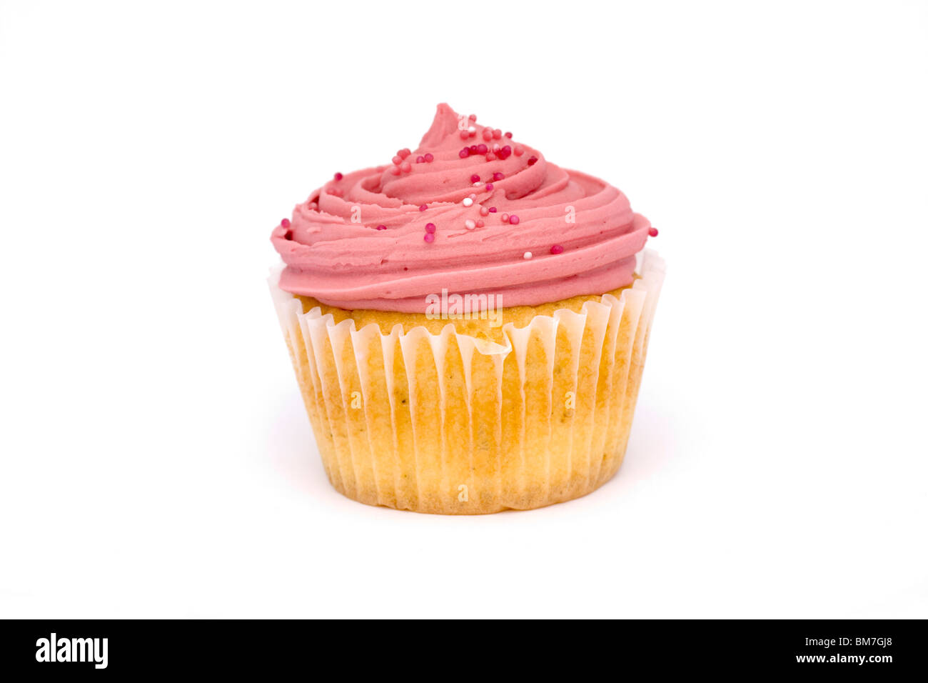 Pink cupcake sobre blanco Foto de stock