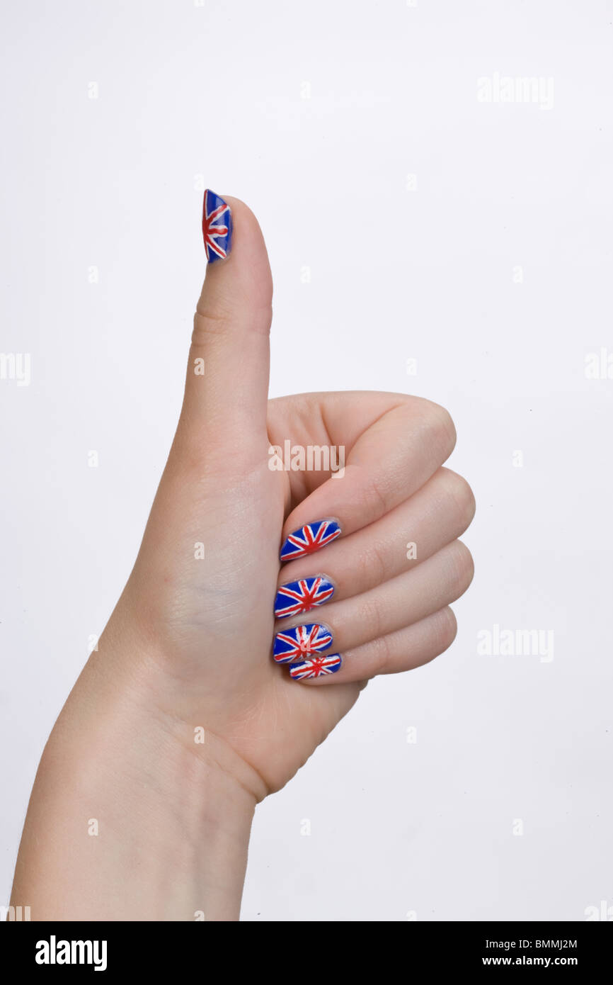 Mano con bandera británica pintada en las uñas de las manos formando un  pulgar arriba firmar Fotografía de stock - Alamy