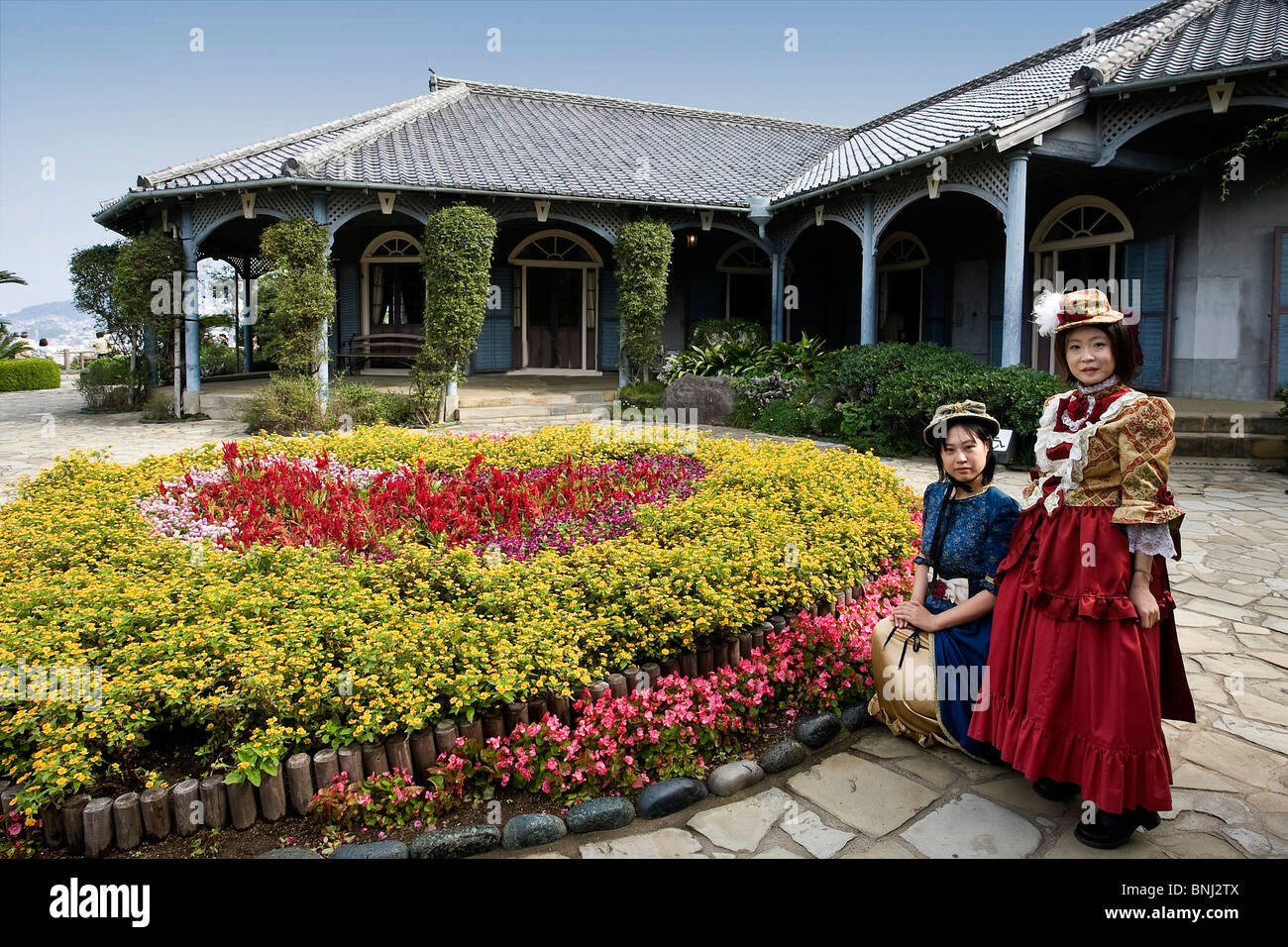 Asia Japón Islandia Kyushu Nagasaki ciudad Glover Garden casa Glover Park trajes traje nacional tradicionalmente la mujer Foto de stock