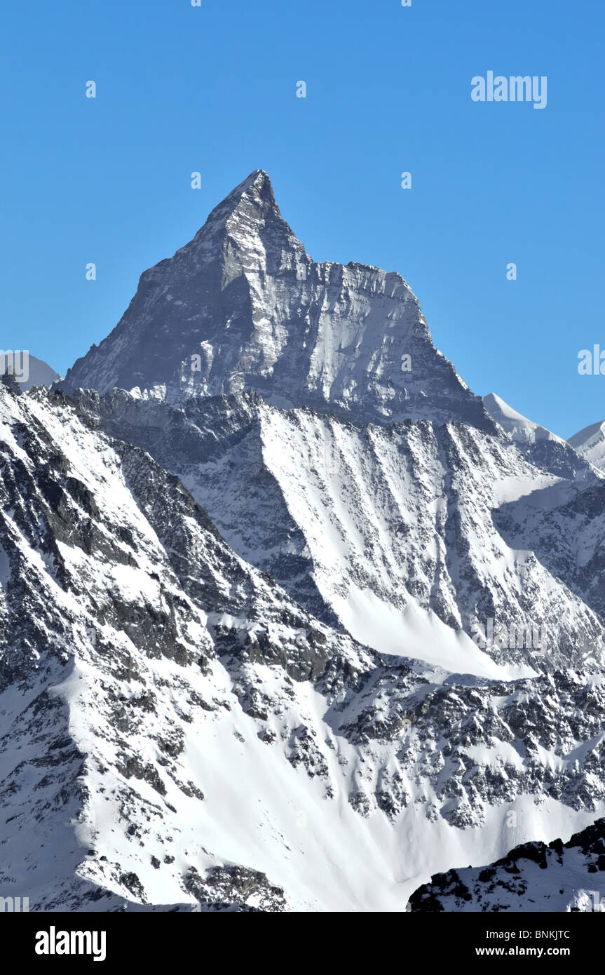 Verticalmente precipitadamente suiza Swiss snow burr Zermatt summit peak pared oeste Alpes montañas Matterhorn Glacier Hörnli Foto de stock