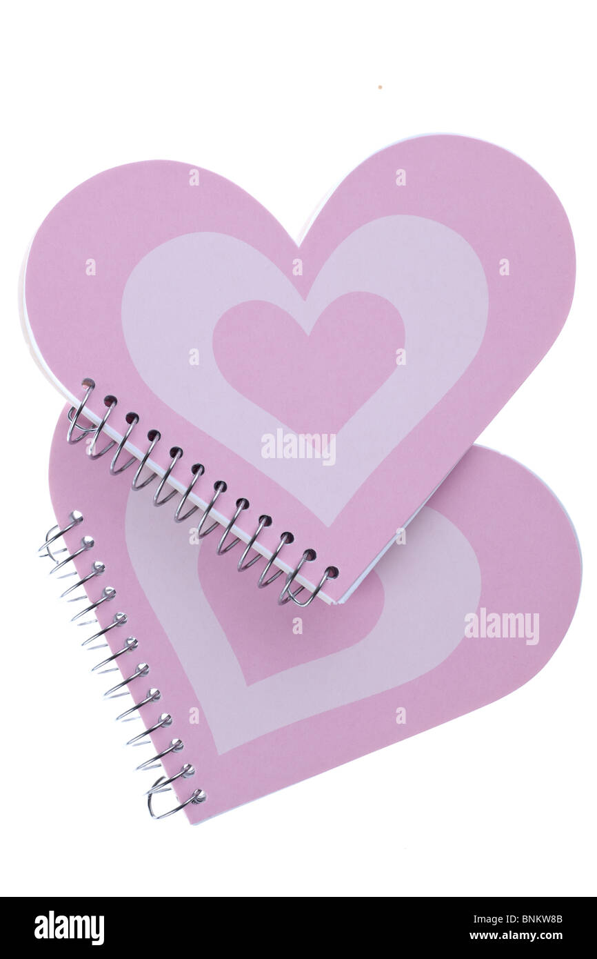 Dos cuadernos de rosa en forma de corazón Foto de stock
