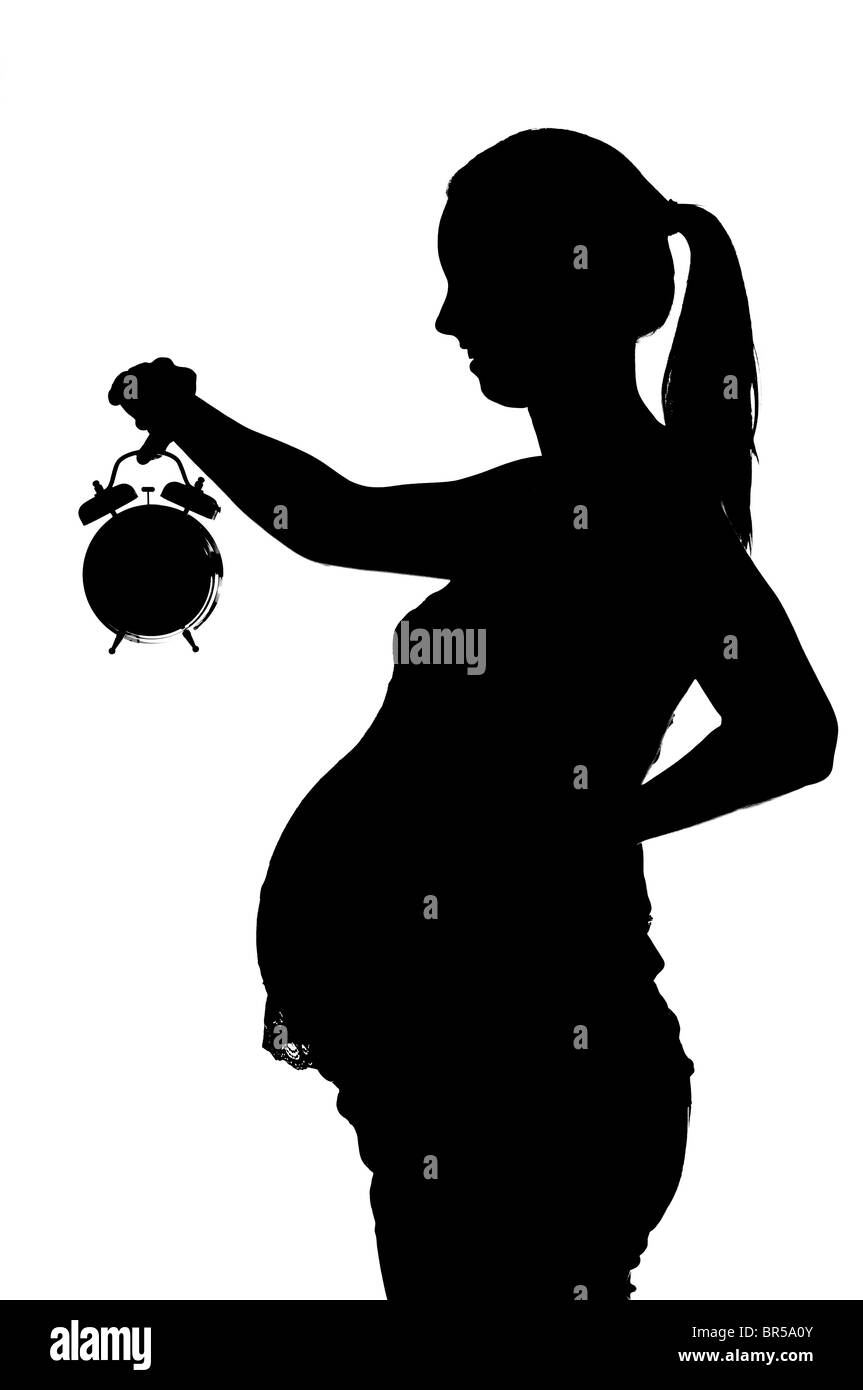 Mujer embarazada sobre fondo blanco. Foto de stock