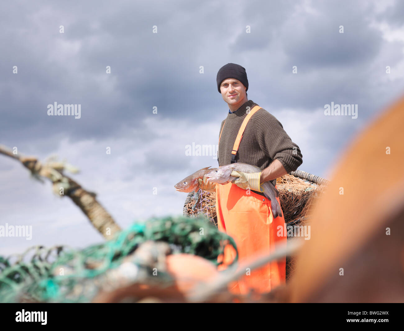 Pescador pescado holding Foto de stock