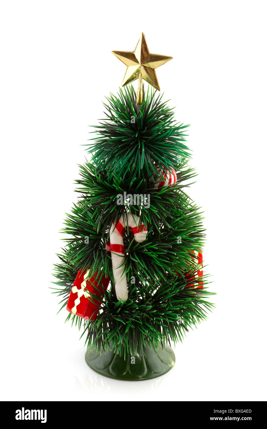 Pequeño árbol de Navidad con la caña y regalos Foto de stock