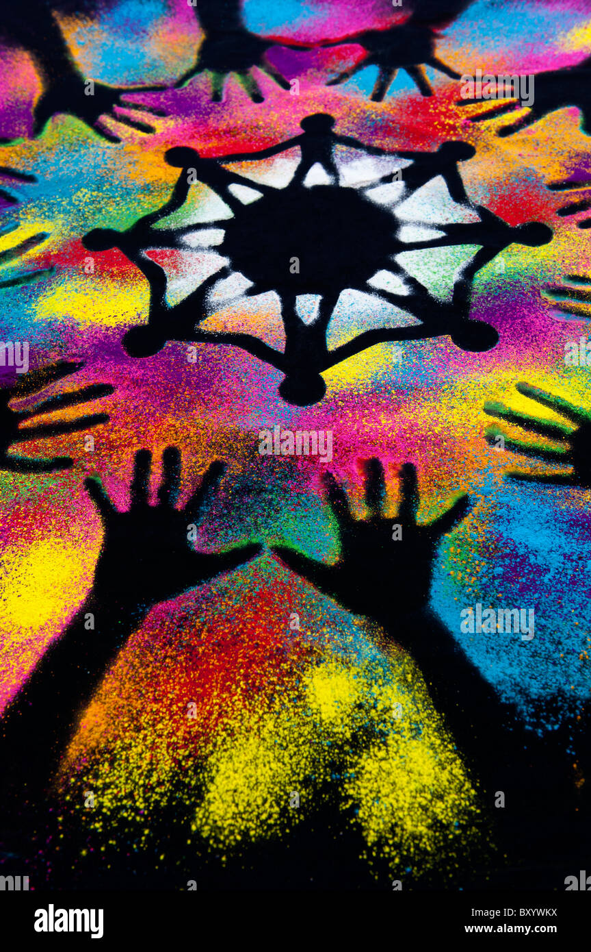 Un símbolo de unidad mundial rodeado por mano infantil impresiones realizadas con polvo multicolor Foto de stock