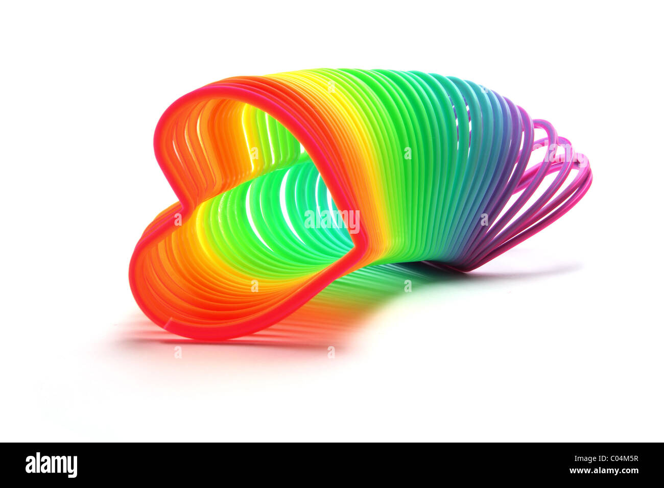 Slinky juguete de muelle de metal en espiral Fotografía de stock - Alamy