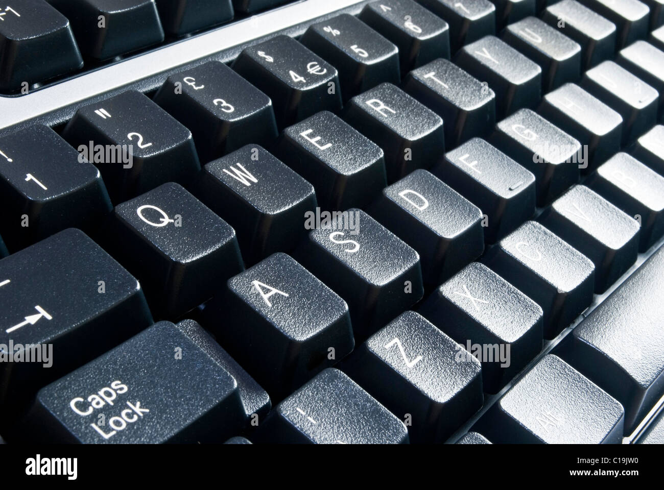 Primer plano horizontal en negro de las teclas del teclado de ordenador Foto de stock