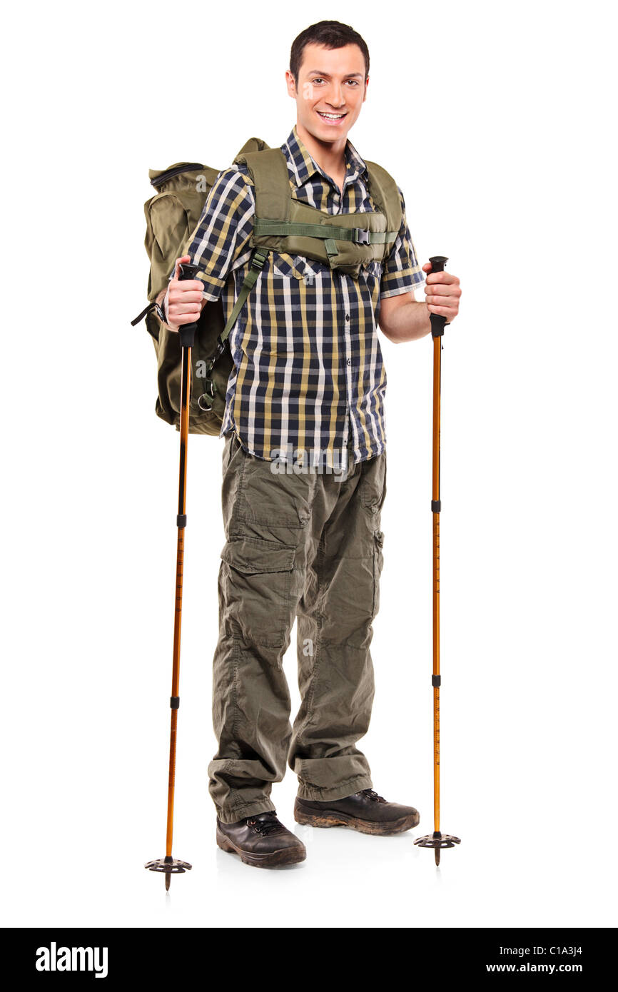 Longitud total retrato de un hombre en ropa deportiva con mochila y  bastones de senderismo Fotografía de stock - Alamy