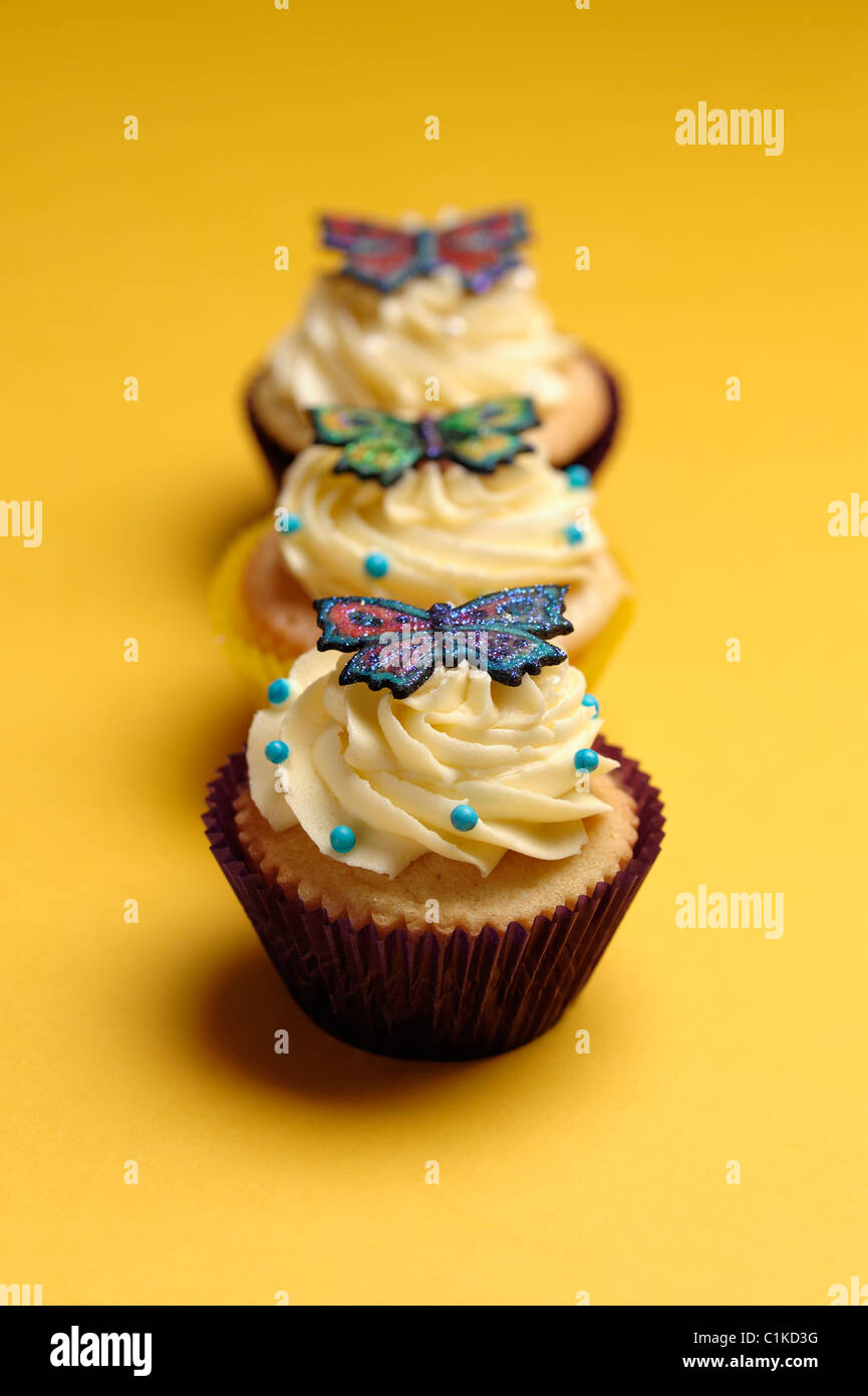 Tres pastelitos (cupcakes) Foto de stock