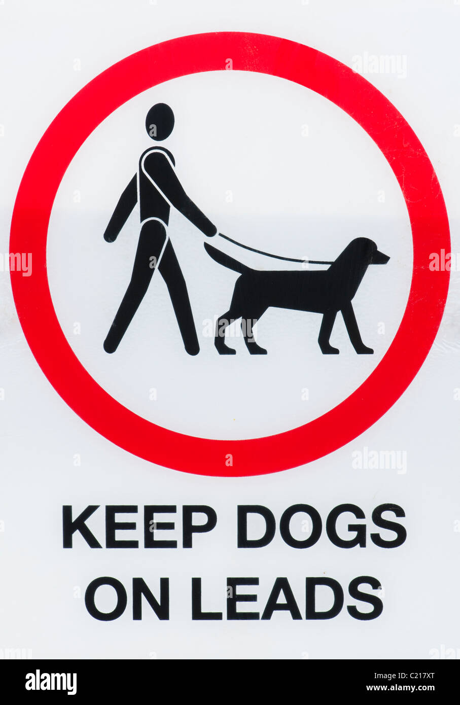 Mantener los perros en signo lleva Foto de stock