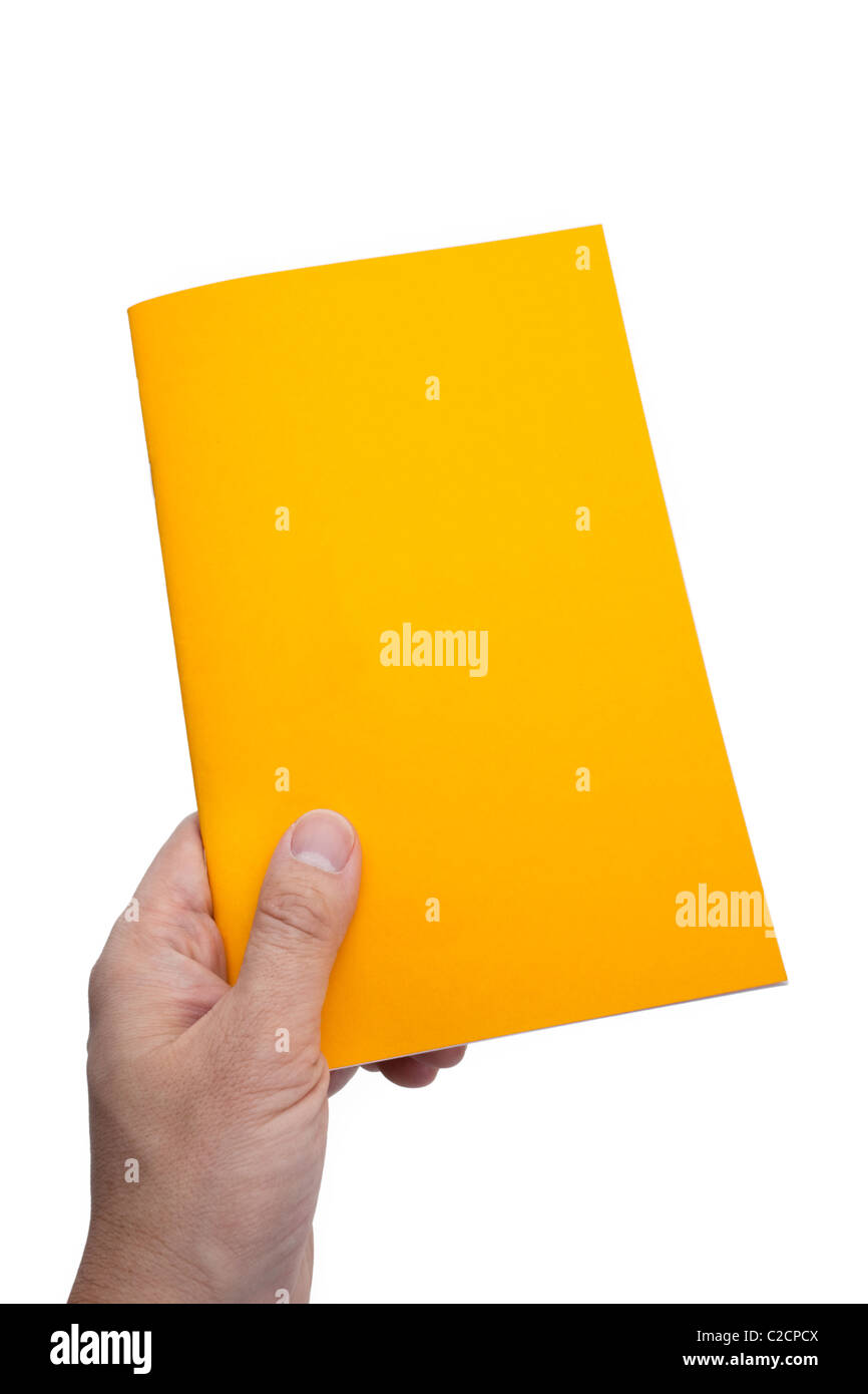 Libro amarillo con fondo blanco. Foto de stock