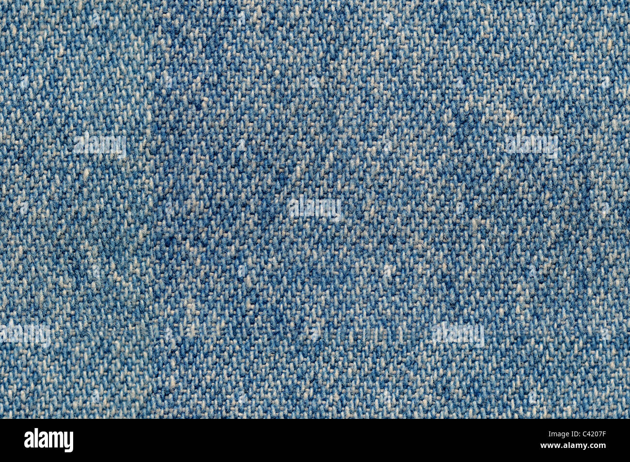 Tejido de tela de mezclilla azul de fondo tileable perfectamente Foto de stock